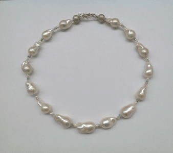 Sterling silver, 18 carat yellow gold, baroque pearls, aquamarine