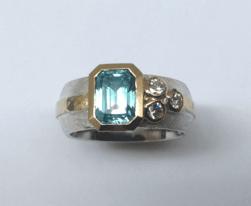 Sterling silver, 18 carat yellow gold, blue zircon diamonds