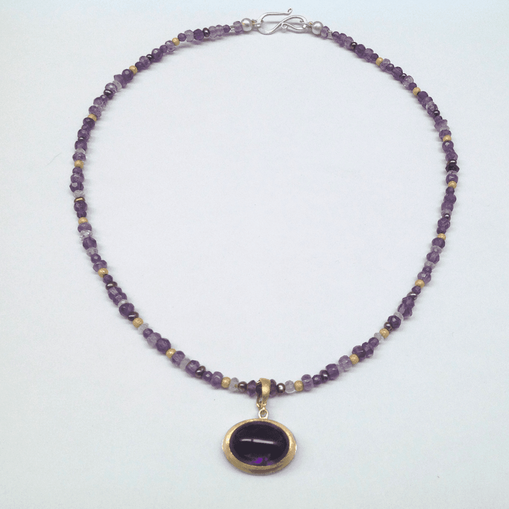 Sterling silver, amethyst, 18 carat yellow gold