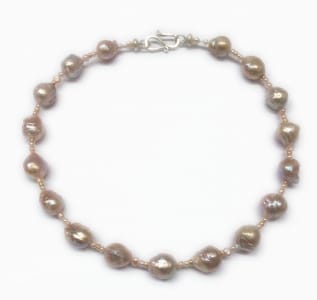 Pink freshwater baroque pearls, 18 carat yellow gold beads, sterling silver clasp