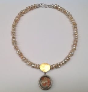 Natural colour freshwater baroque pearls, quartz pendant set in sterling silver with 22 carat gold detail