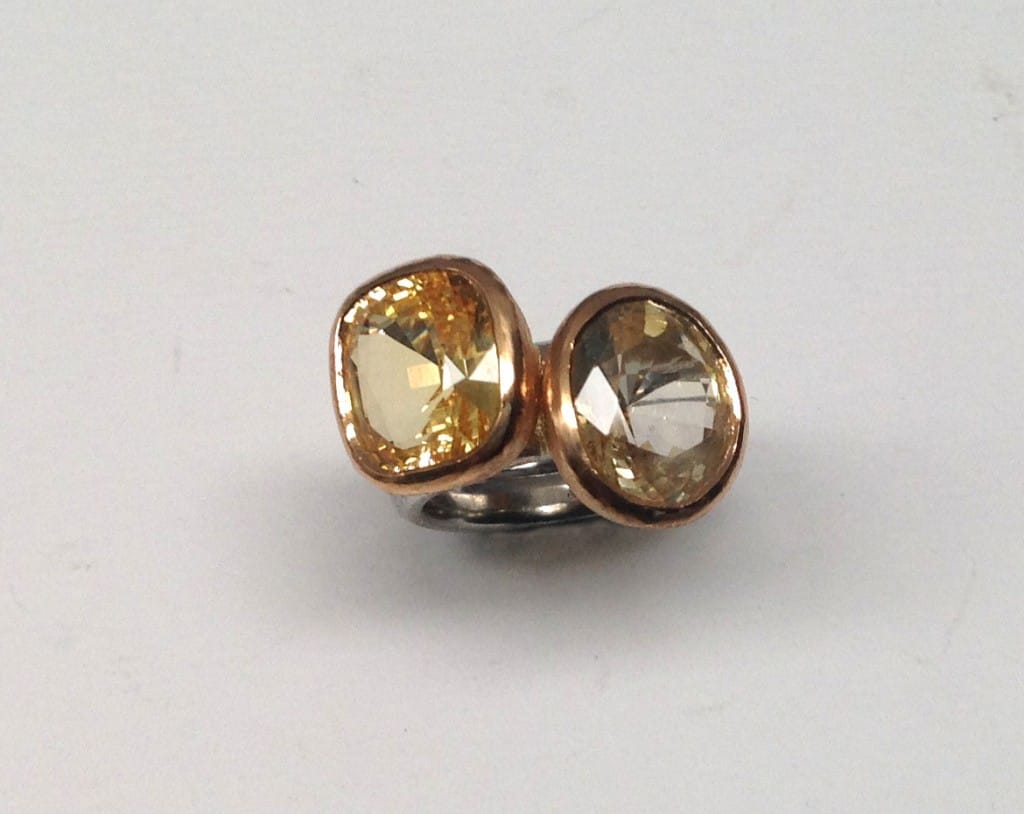 Two rings to be worn together. Yellow sapphires set in 22 carat gold, platinum shanks.