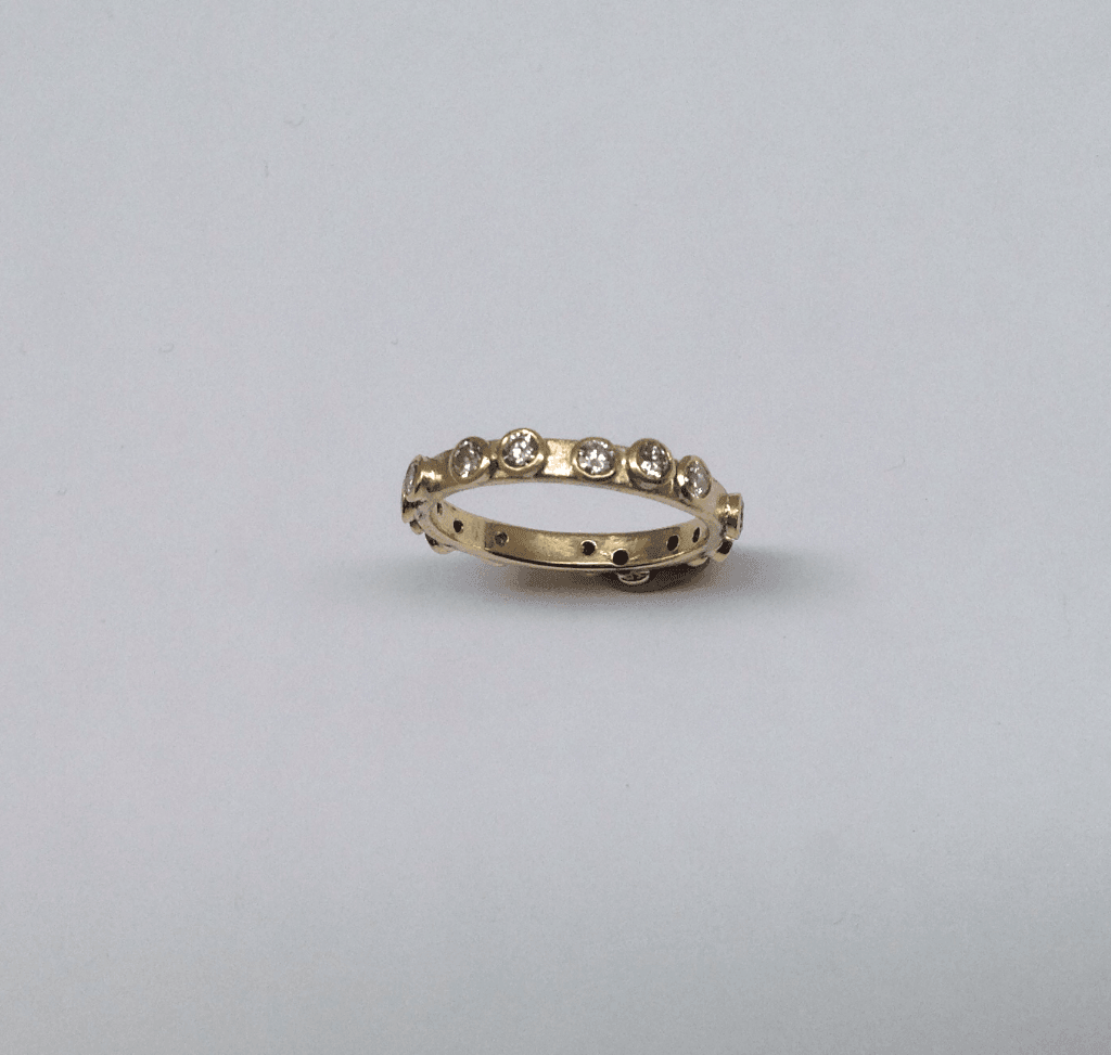 Diamond and 18 carat yellow gold eternity ring