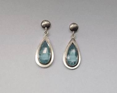 Aquamarine drops set in 18 carat white gold, sterling silver