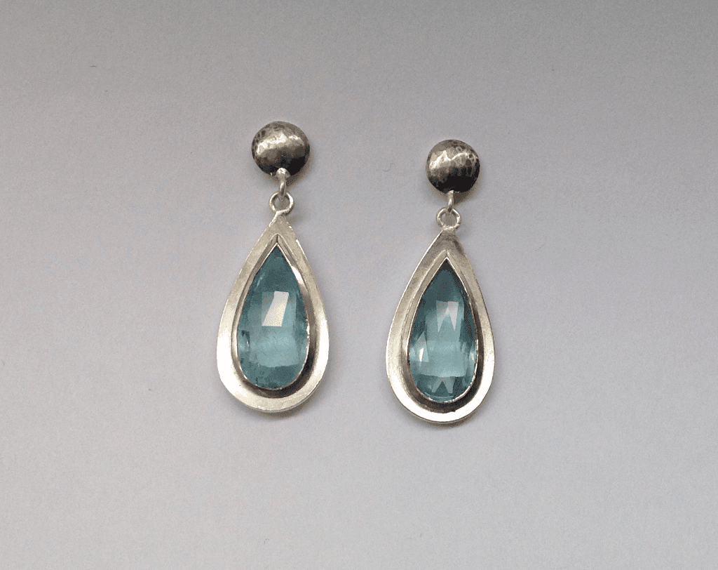 Aquamarine drops set in 18 carat white gold, sterling silver