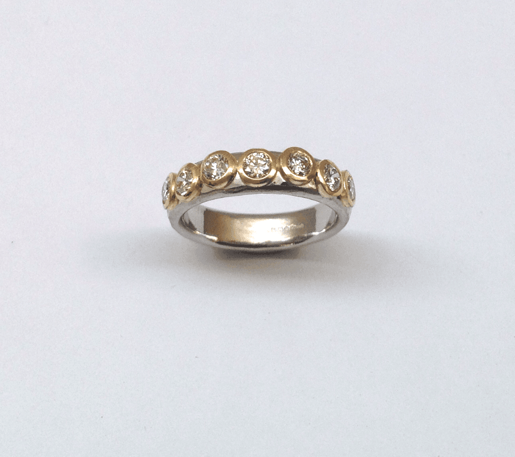 Diamonds set in 18 carat yellow gold on platinum band