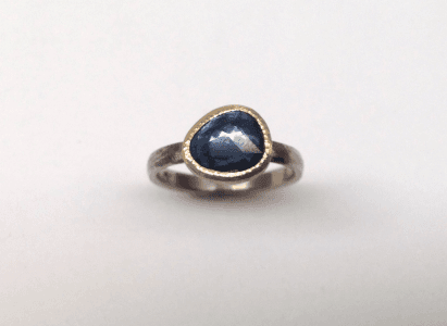Organic shaped rose cut sapphire set in 18 carat gold, sterling silver