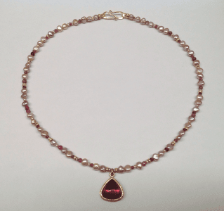 Rubellite tourmaline set in 18 carat yellow gold, pink freshwater pearls, garnet pink tourmaline and 18 carat yellow gold beads