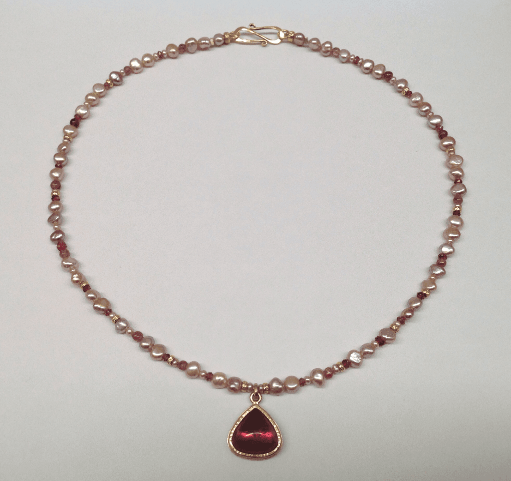 Rubellite tourmaline set in 18 carat yellow gold, pink freshwater pearls, garnet pink tourmaline and 18 carat yellow gold beads