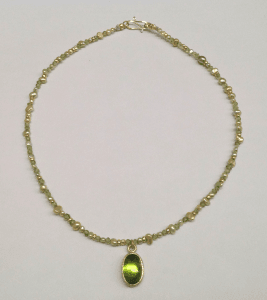 Peridot set in 18 carat yellow gold, peridot beads, freshwater pearls