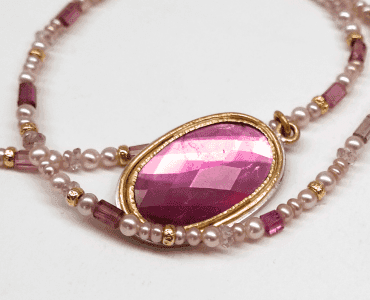 Pink tourmaline set in 18 carat yellow gold, pink pearls and tourmaline beads
