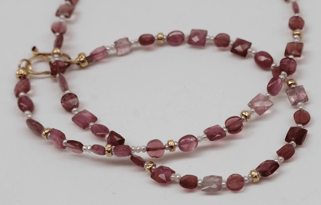 Pink tourmaline and garnet beads, pink pearls and 18 carat gold yellow beads