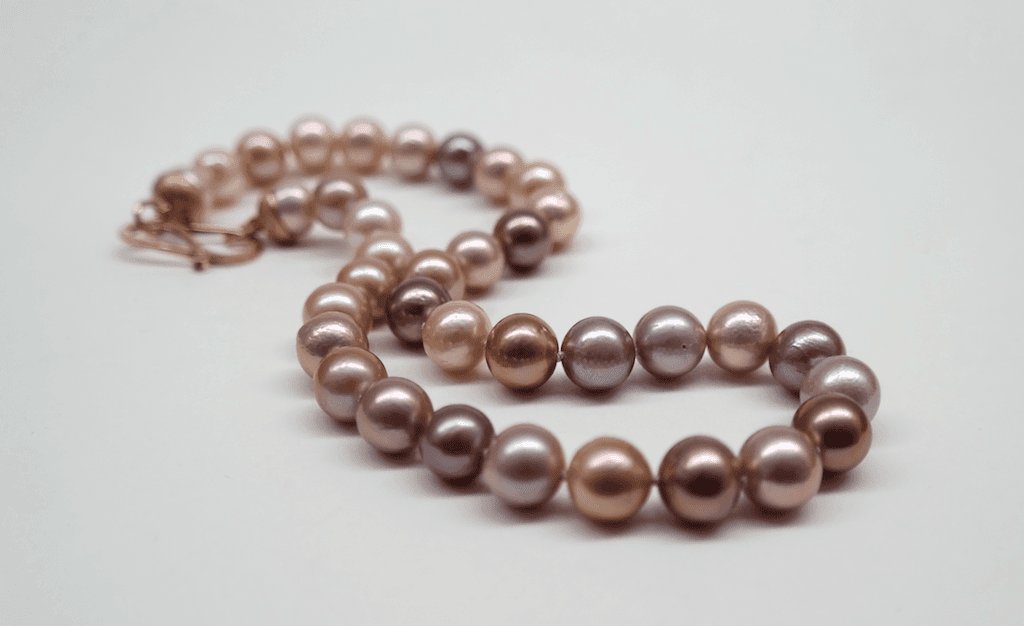 Natural intense pink freshwater pearls, 9 carat rose gold clasp