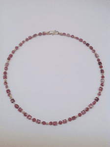 Pink tourmaline and garnet beads, pink pearls and 18 carat gold yellow beads