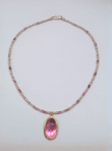 Pink tourmaline set in 18 carat yellow gold, pink pearls and tourmaline beads