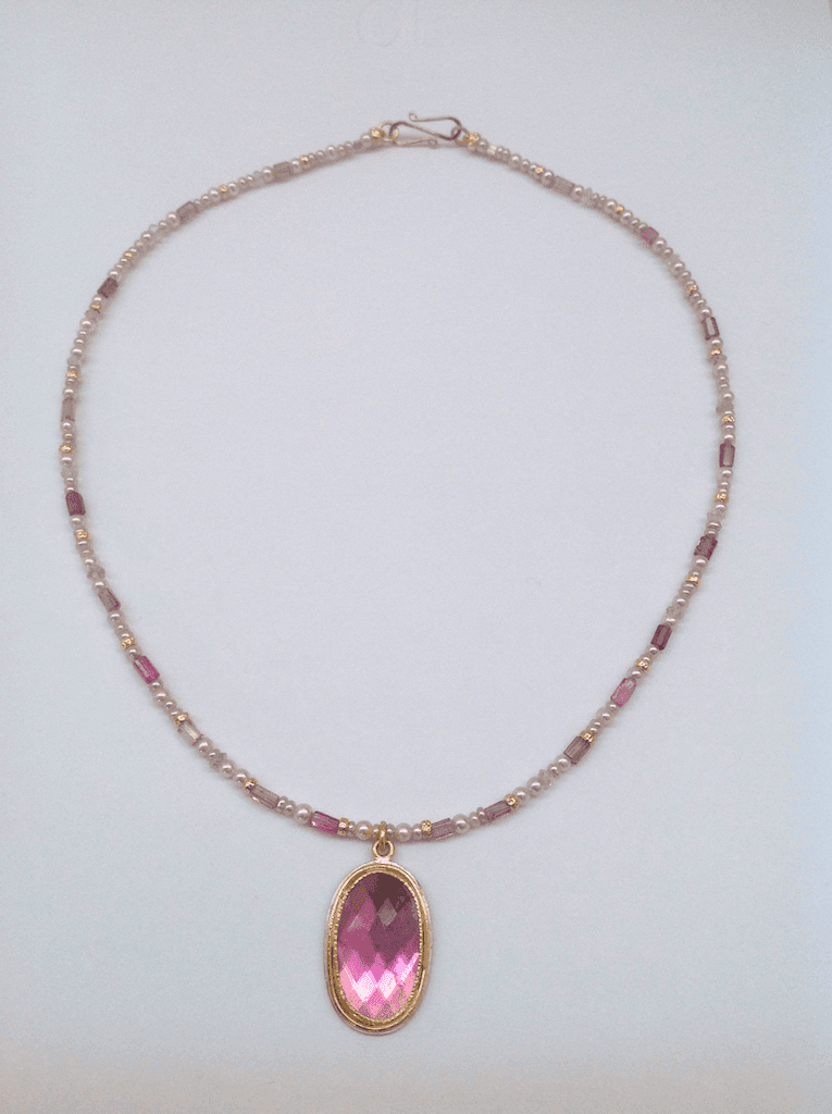 Pink tourmaline set in 18 carat yellow gold, pink pearls and tourmaline beads