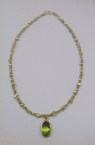Peridot set in 18 carat yellow gold, peridot beads, freshwater pearls
