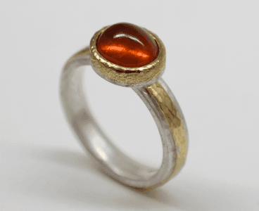 Mandarin garnet set in 18 carat yellow gold, sterling silver