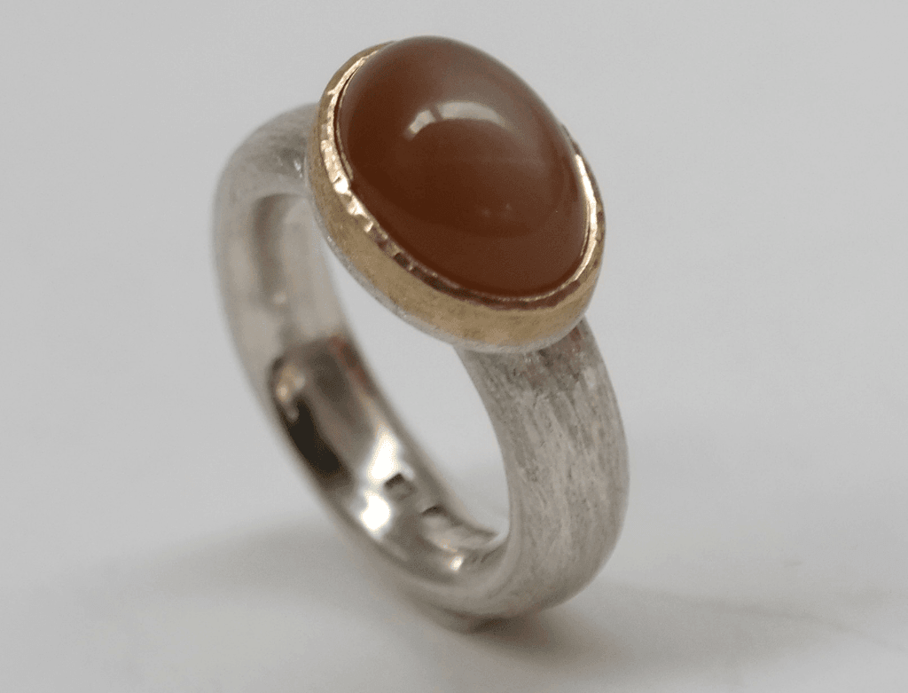 Fawn moonstone set in 9 carat rose gold, sterling silver