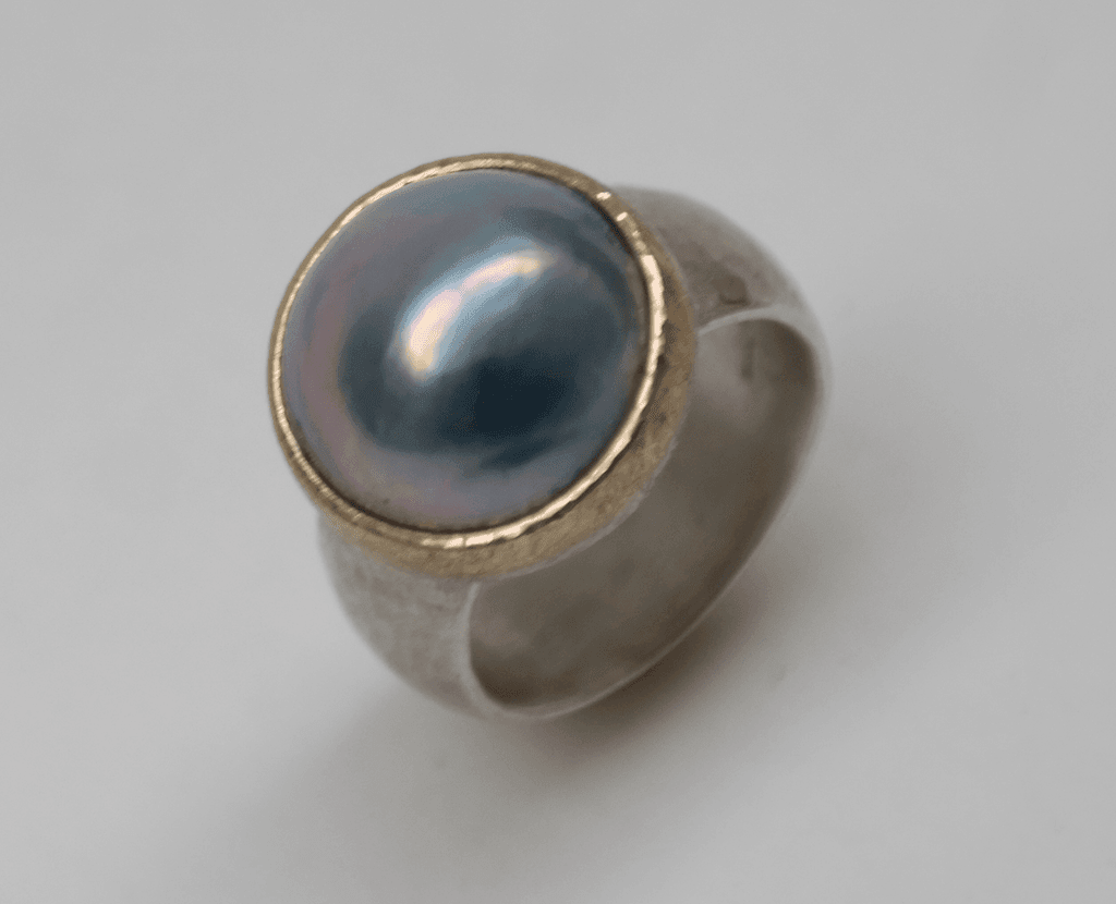 Blue mabe pearl set in 9 carat rose gold, sterling silver