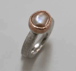 Pink baroque pearl set in 18 carat rose gold, sterling silver